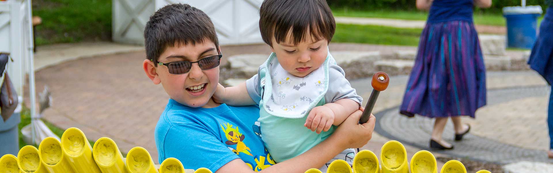 child playing with sibling
