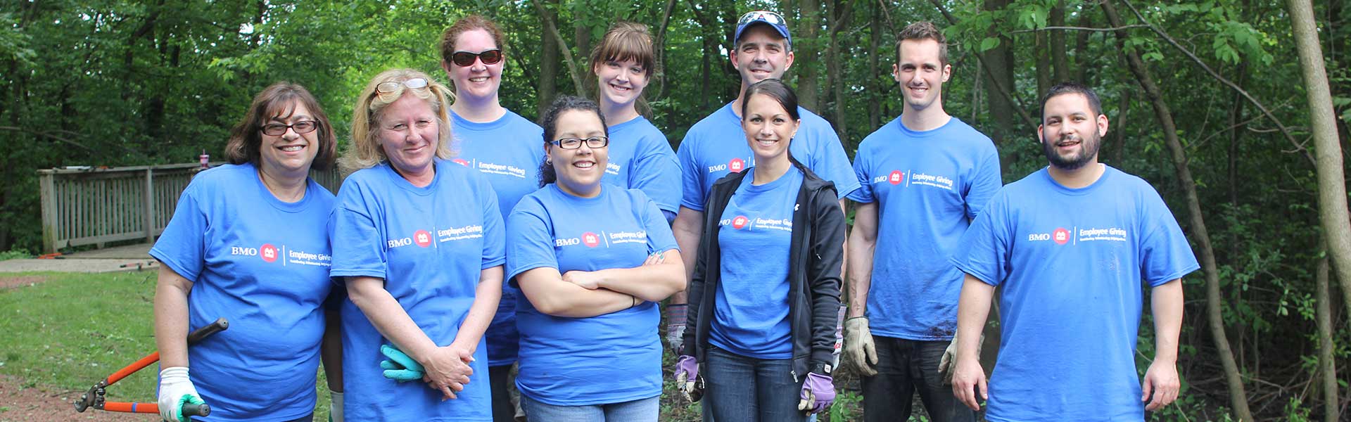 Volunteers pose at Sensory Garden Playground work day Volunteers pose at Sensory Garden Playground work day