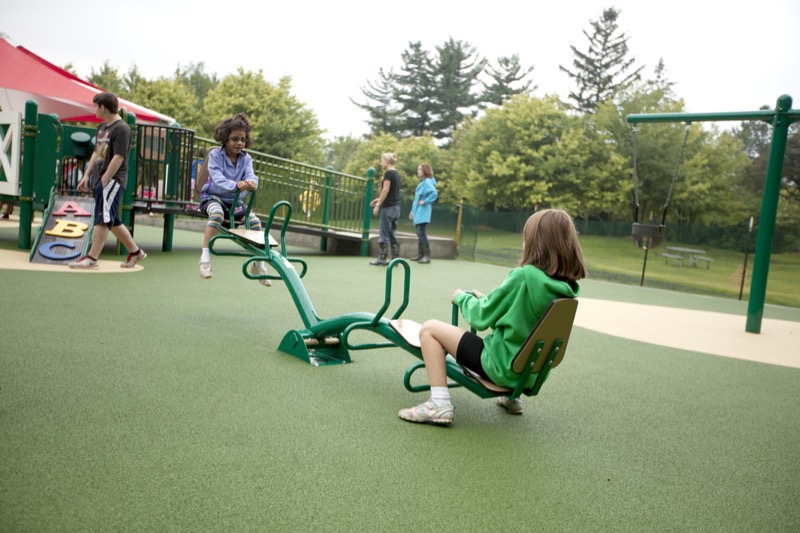 Children playing on seesaw