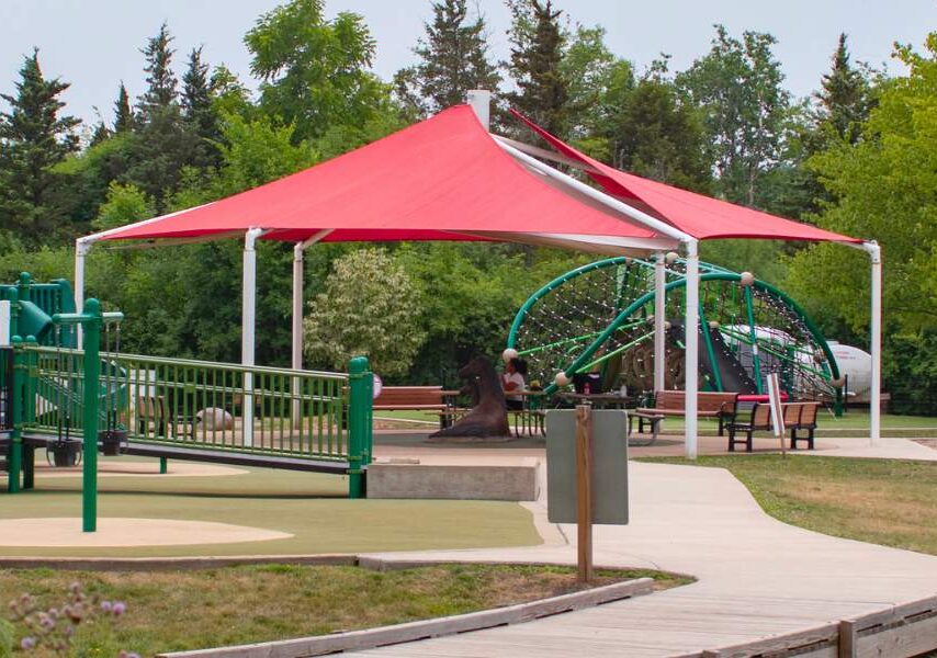 Sensory Garden Playground with red roof sitting bench area