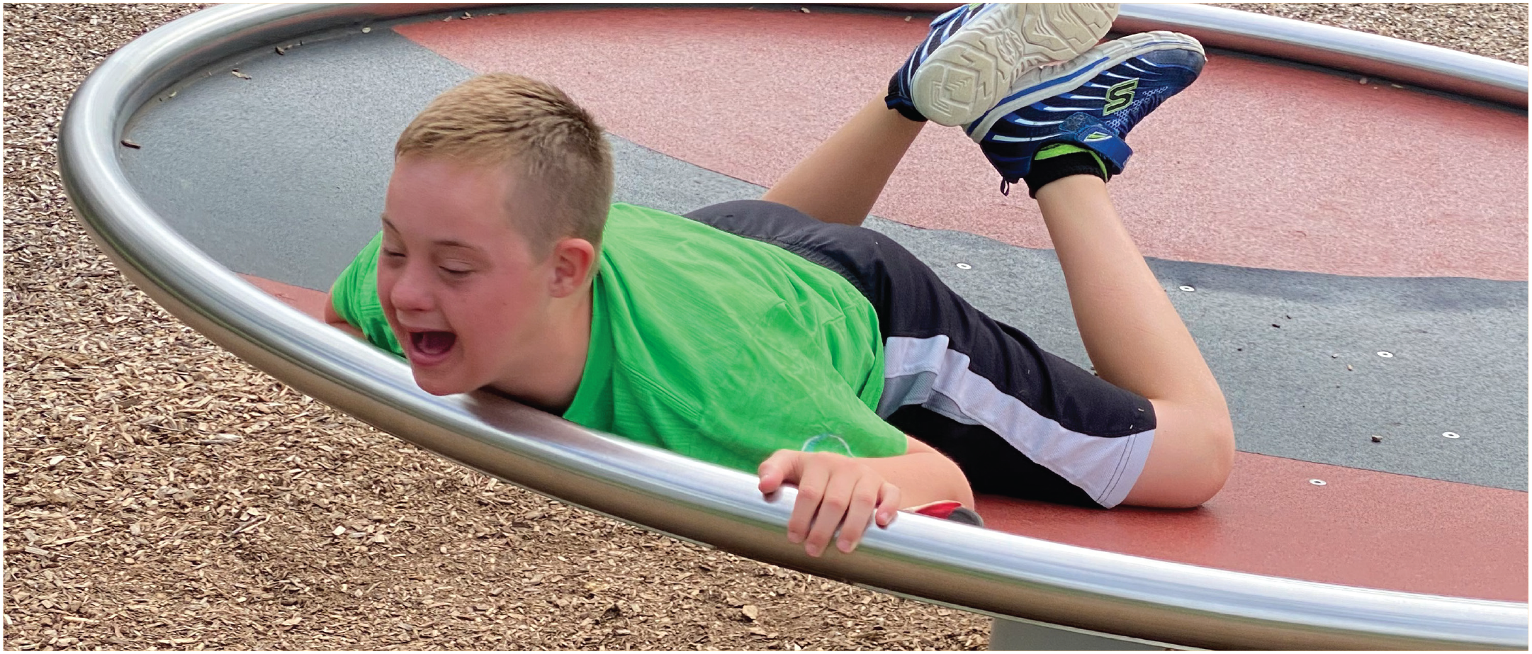 Boy having fun on the disk spinner