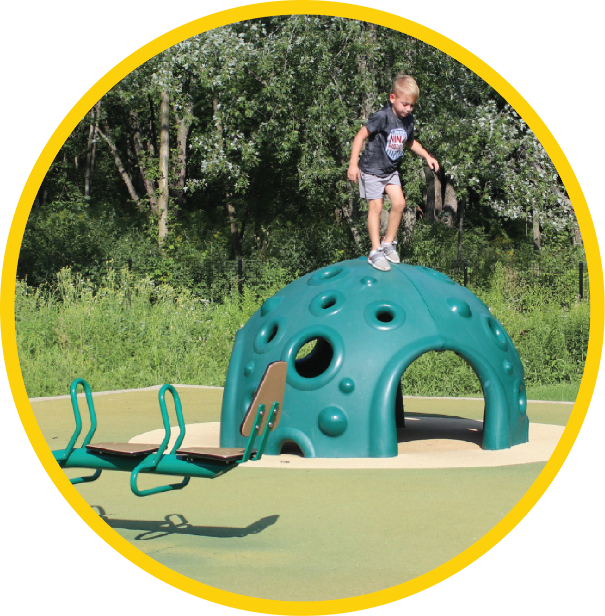 Boy on top of playground area