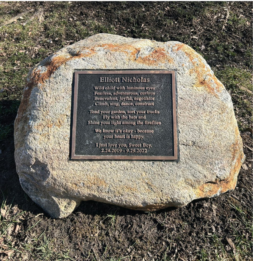 A memorial plaque inside a rock for Elliott Nicholas Senkevicius