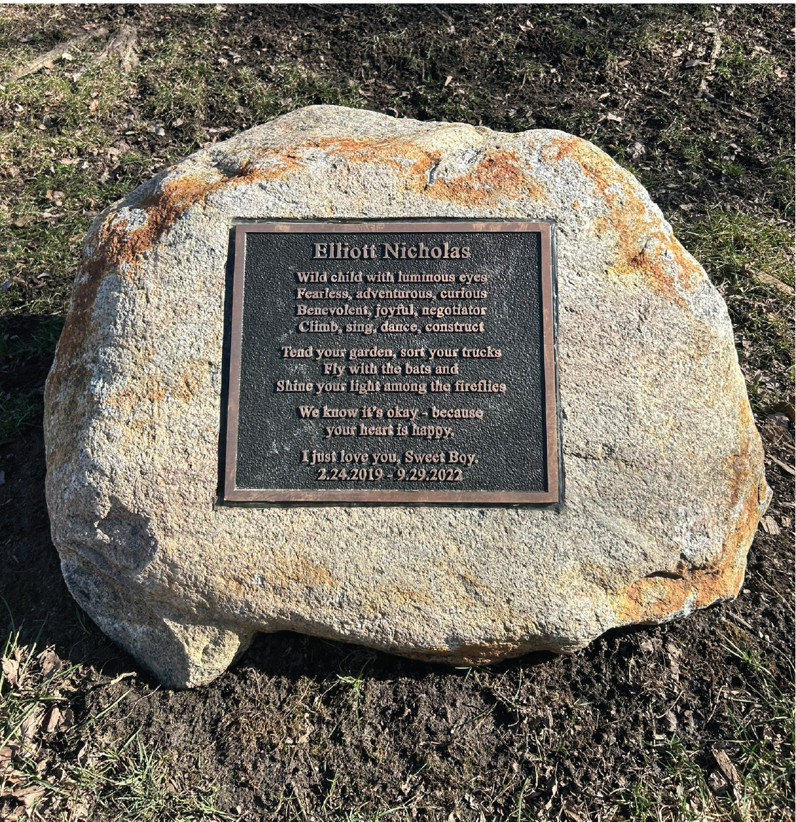 A memorial plaque inside a rock for Elliott Nicholas Senkevicius